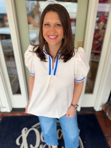 Ivory textured top with dark blue and light blue detailing 