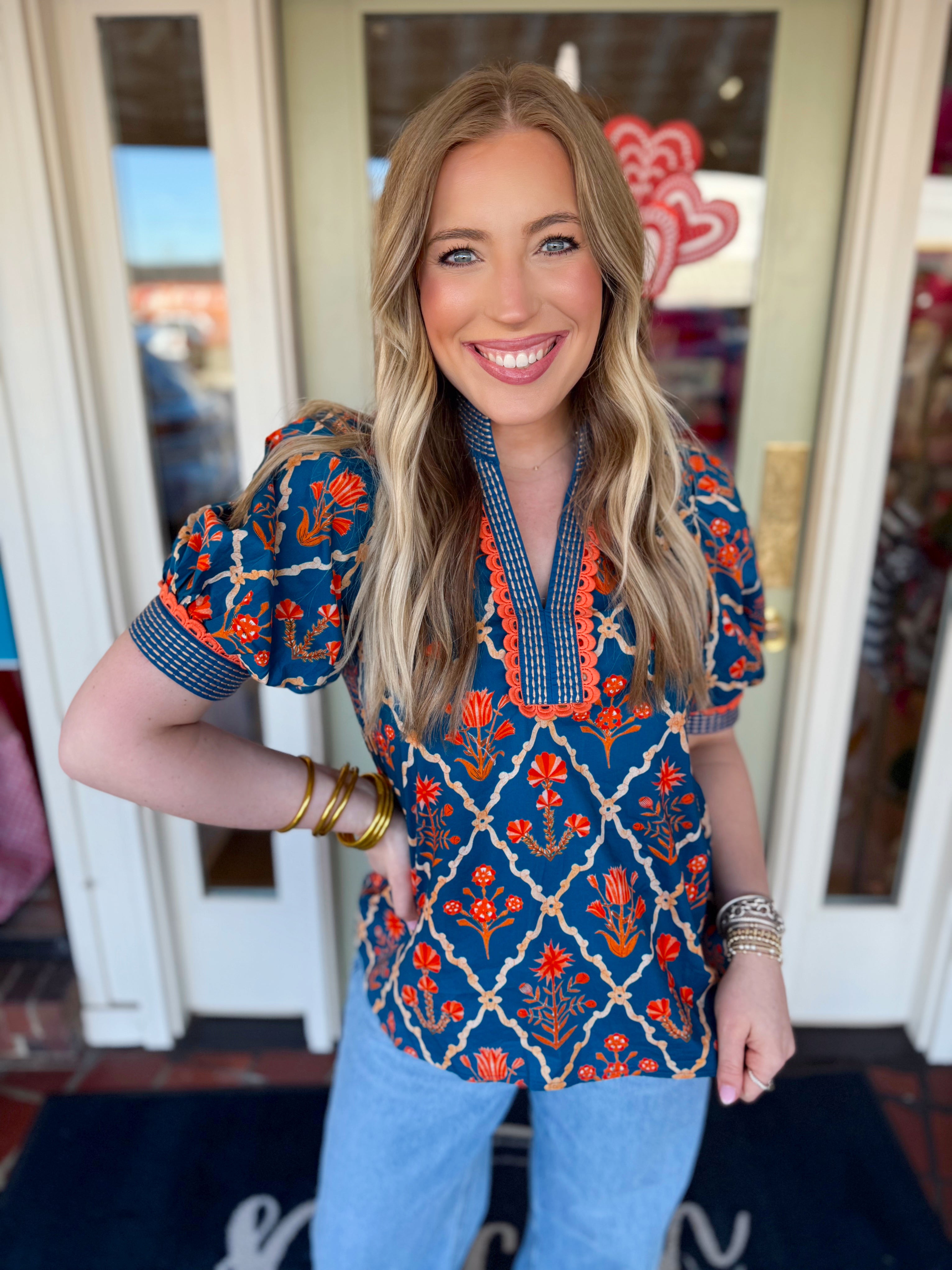 Floral puff sleeve top with detailing on the trim 