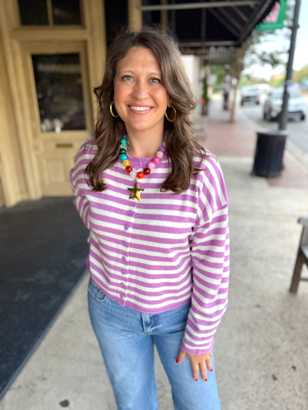Purple and white button down sweater.