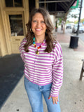 Purple and white button down sweater.