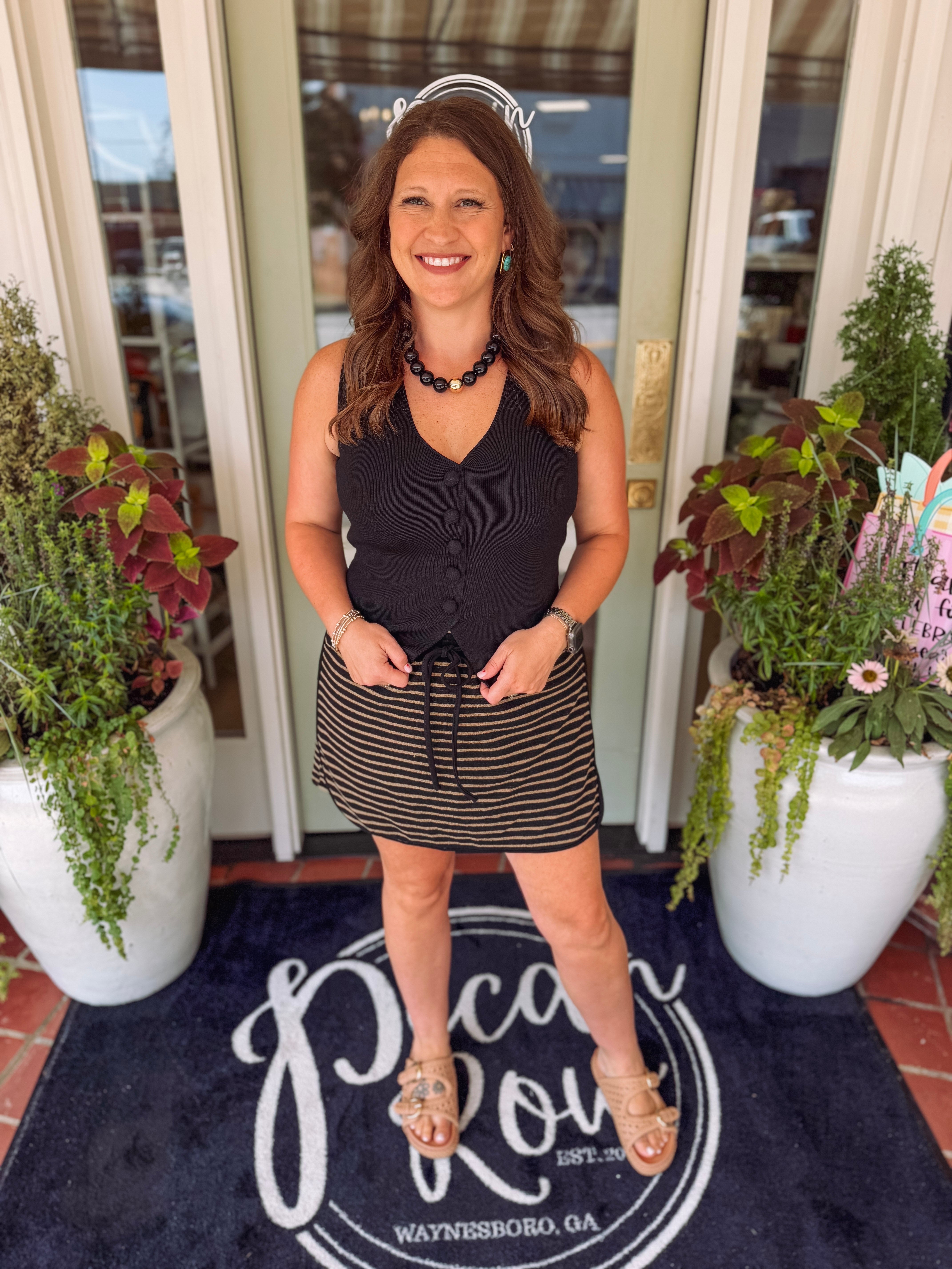 Black and taupe striped skort with an elastic waistband and pockets