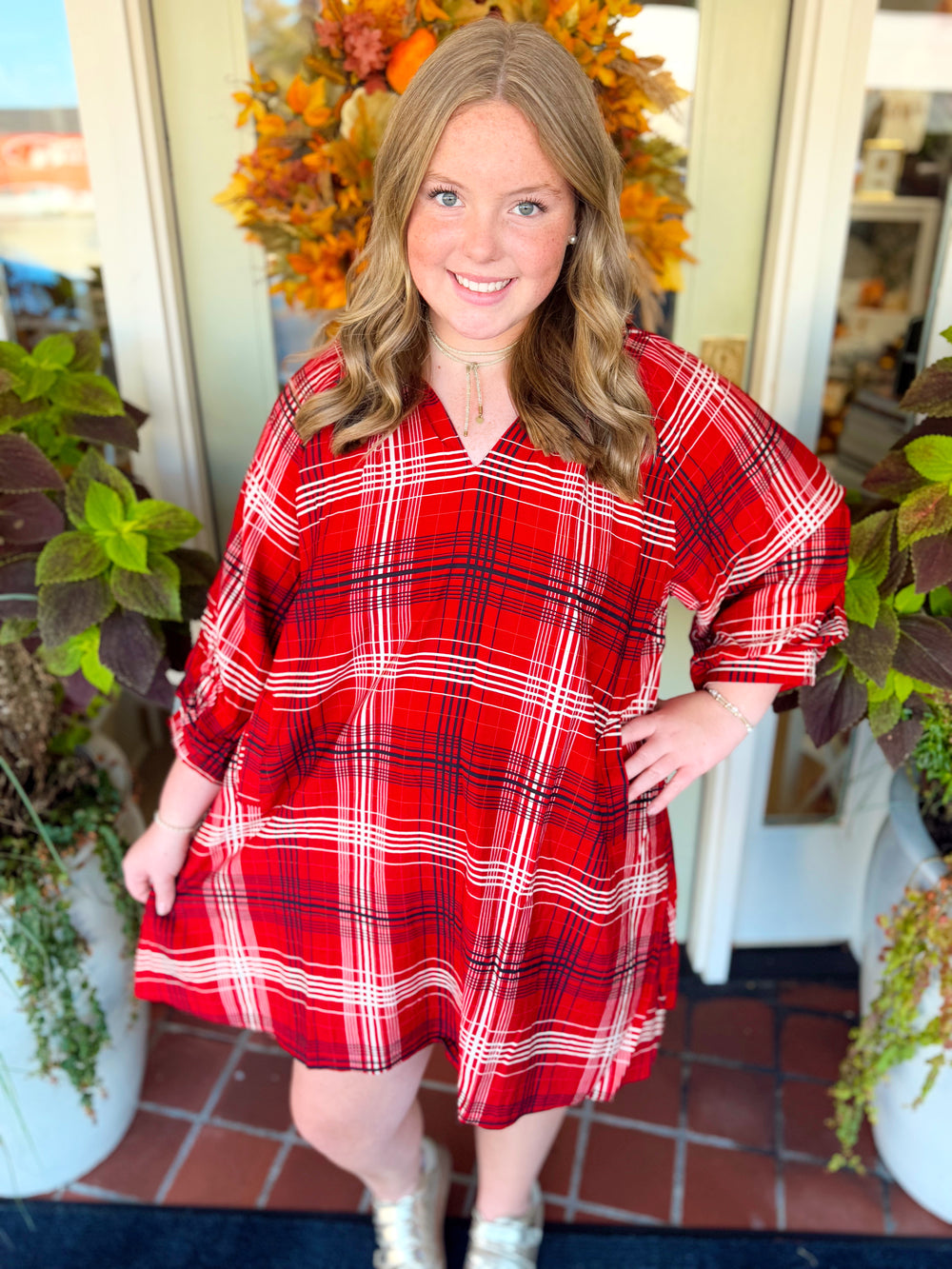 This plaid style features a flattering split V-neckline with a smocked back yoke for added detail and shape.