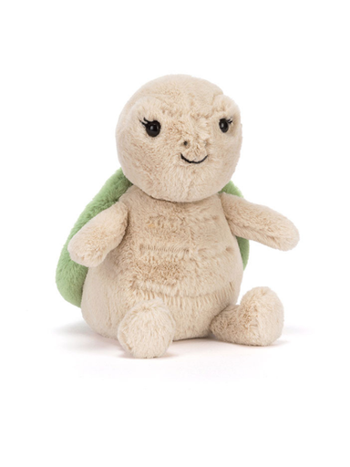 Plush turtle toy with a smiling face on a white background