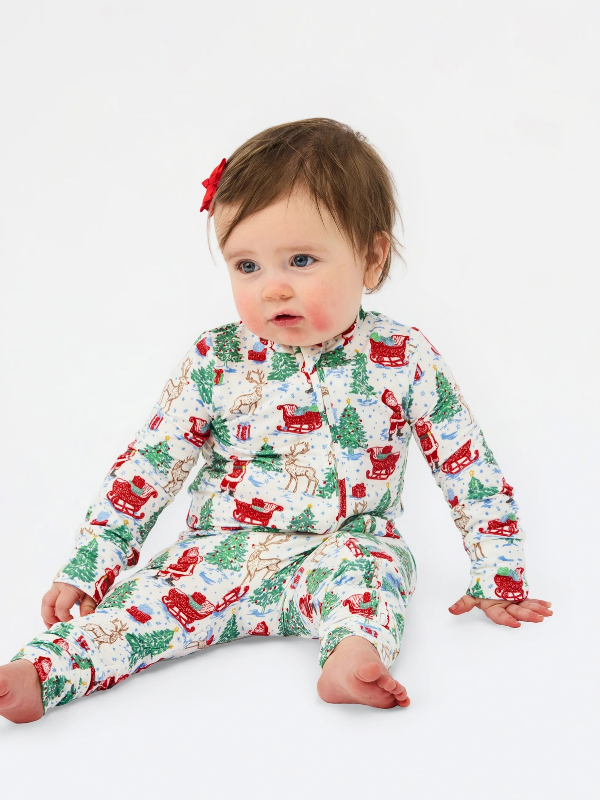 red sleigh, reindeer and santa on baby pjs