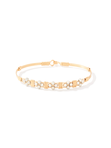 Gold wire bracelet with delicate beaded floral design featuring small white beads, handcrafted with an elegant and timeless style.