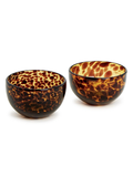 Two tortoiseshell patterned bowls on a white background