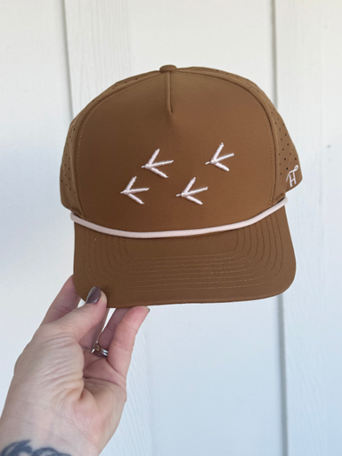 brown hat with cream color turkey tracts on it front