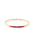 Gold wire bracelet with red and black center beads by Ronaldo, a timeless piece that can be worn for years to come