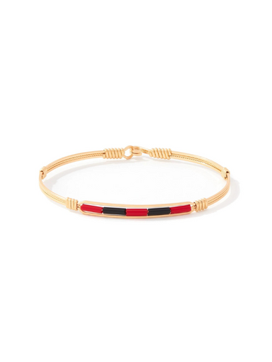 Gold wire bracelet with red and black center beads by Ronaldo, a timeless piece that can be worn for years to come