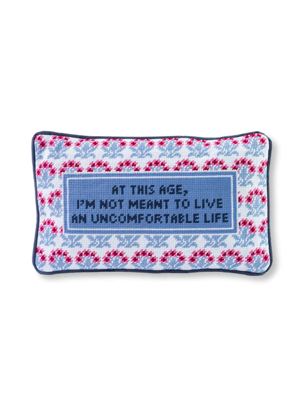 Needlepoint pillow with "At this age, I'm not meant to live an uncomfortable life"