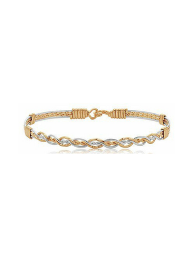 Gold and silver braided bracelet on a white background
