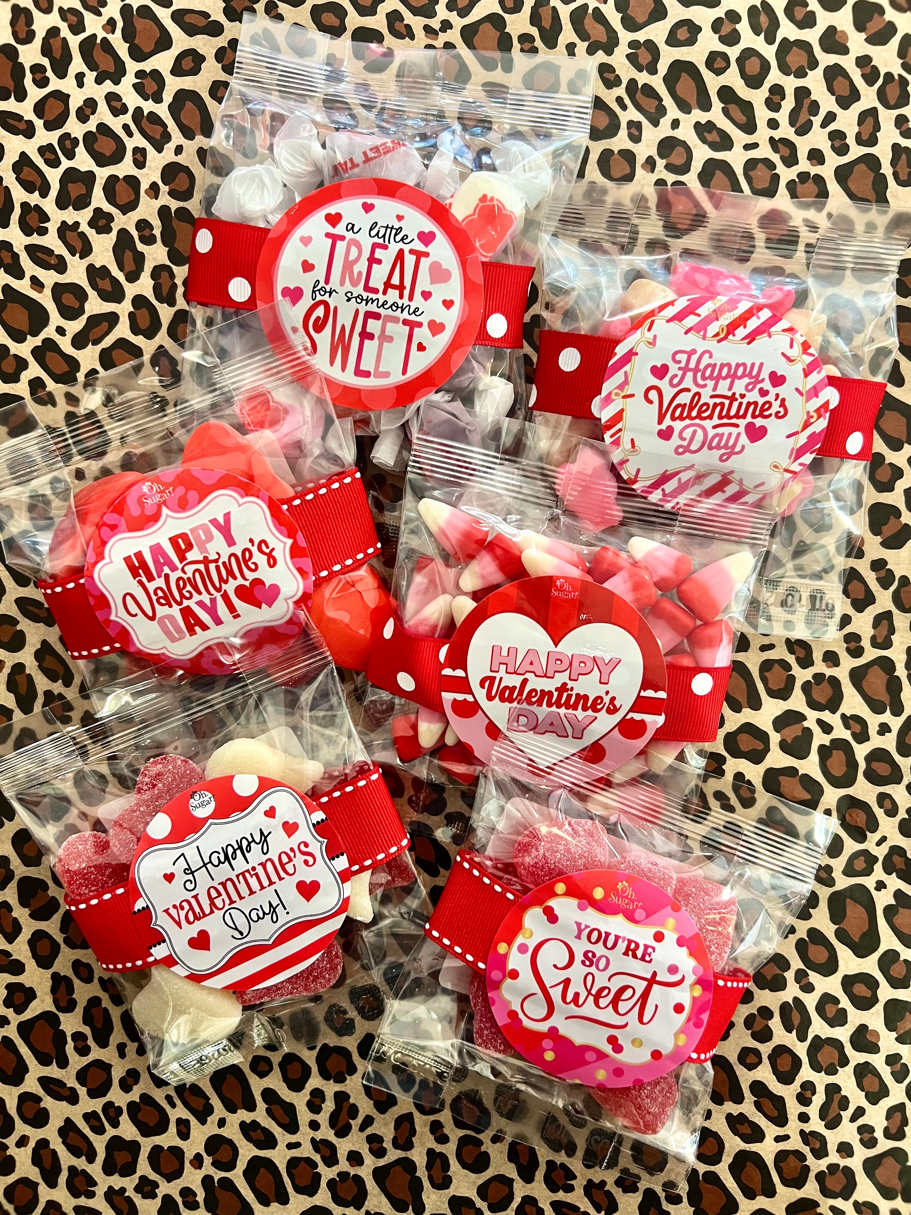Packaged treats with Valentine's Day labels on a leopard print background