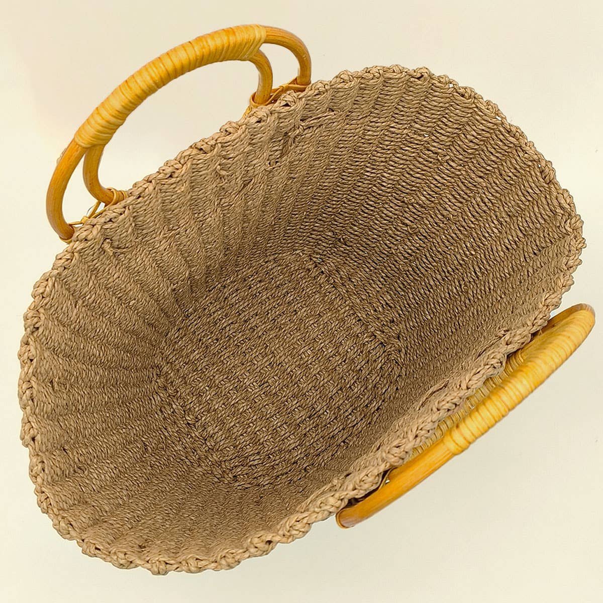 Brown textured handbag with wicker handle 