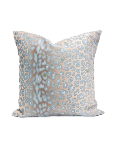 Decorative pillow with a light blue and beige leopard print pattern
