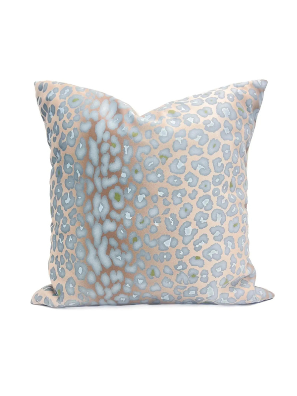 Decorative pillow with a light blue and beige leopard print pattern