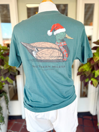 This muted teal Southern Marsh tee features a classic mallard decoy dressed for the season in a Santa hat and plaid scarf.