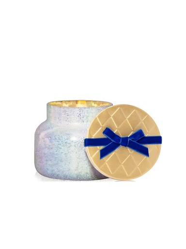 frosted candle with gold lid with blue velvet ribbon