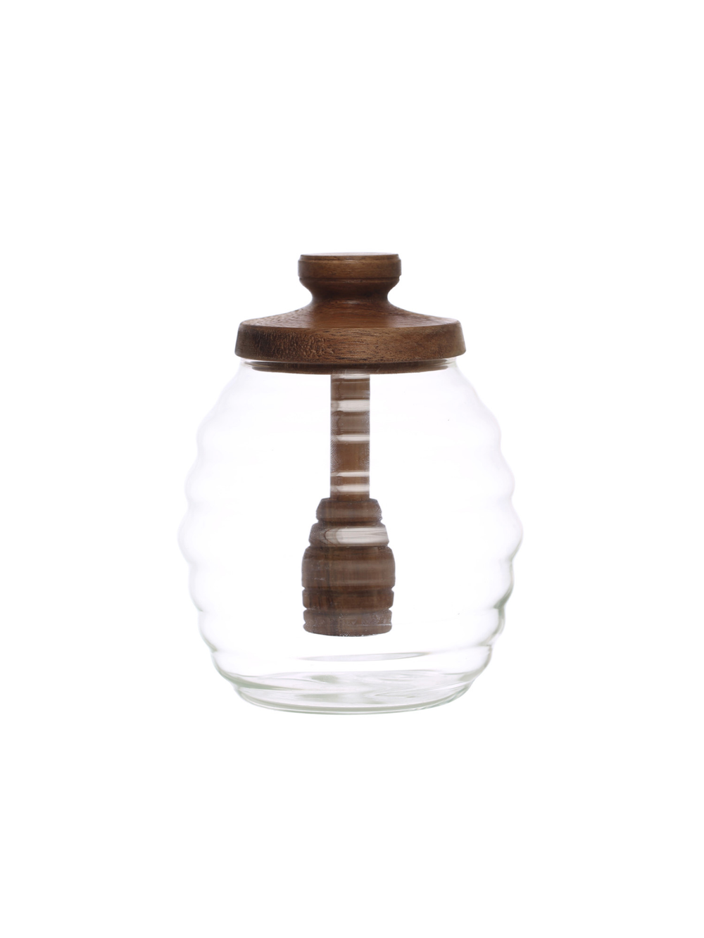 Clear glass honey pot with a wooden lid and integrated honey dipper, featuring a softly scalloped shape and timeless kitchen style.