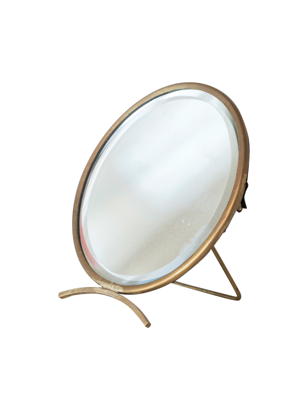 Round tabletop mirror with an antique brass frame and freestanding curved base, perfect for vanities, dressers, bathrooms, and decorative shelf styling.
