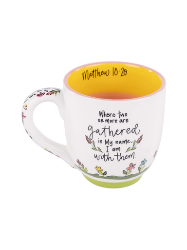 White mug with floral designs and painting of a church. Features Matthew 18:20 Bible Verse 