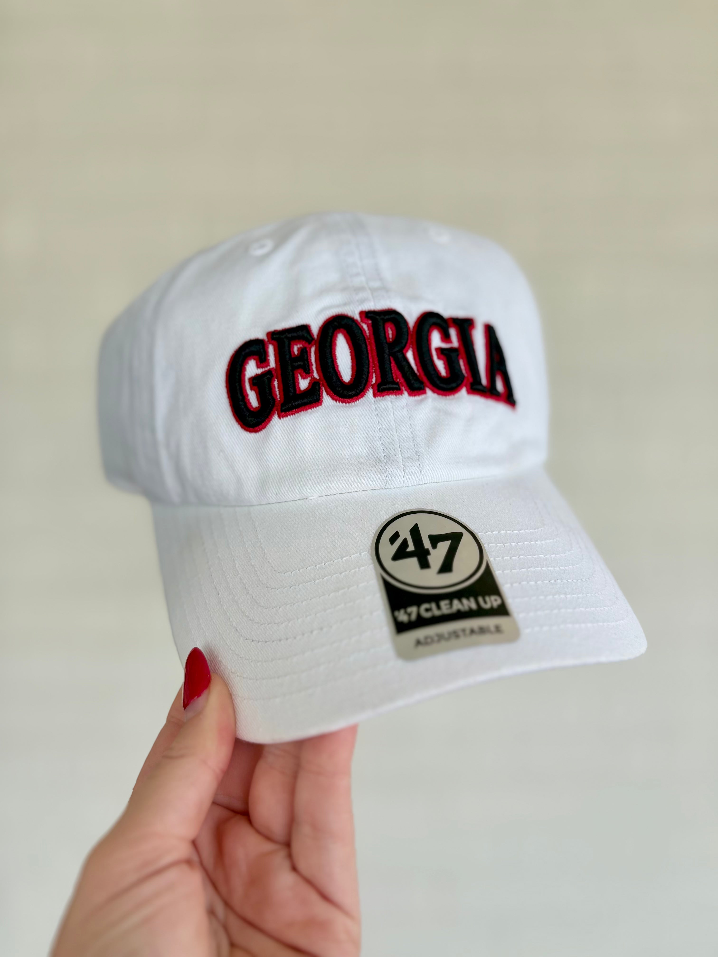 A white baseball cap with 'GEORGIA' embroidered in red and black arched lettering on the front