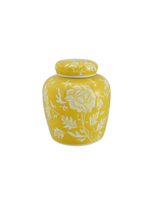 A small yellow ceramic jar with a matching lid, decorated with a white floral pattern.