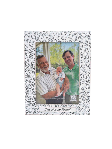 Decorative photo frame with a floral pattern.