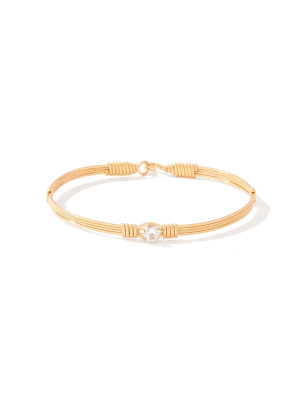 Gold bracelet on a white background