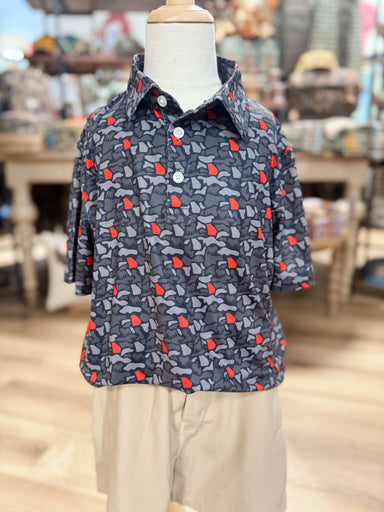 A polo that features gray and black camo-inspired print accented with pops of bold red, giving it the perfect Georgia-inspired color combination. 