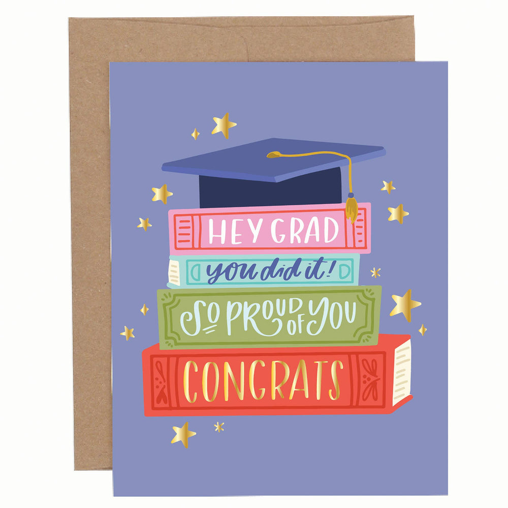 books stacked up with congratulations sayings 