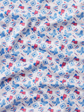 Fabric with red, white, and blue pattern featuring eagles and flags on a white background