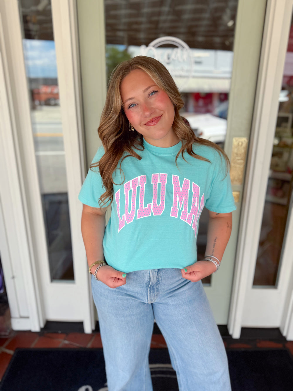mint tee with polka dot brand name 