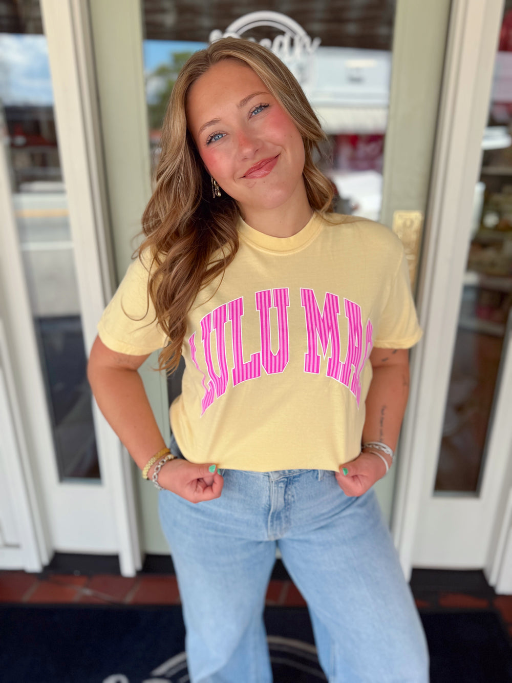 yellow t-shirt with striped brand name